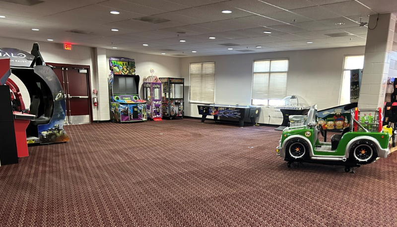 Indoor children's arcade with red patterned carpet immediately after carpet cleaning